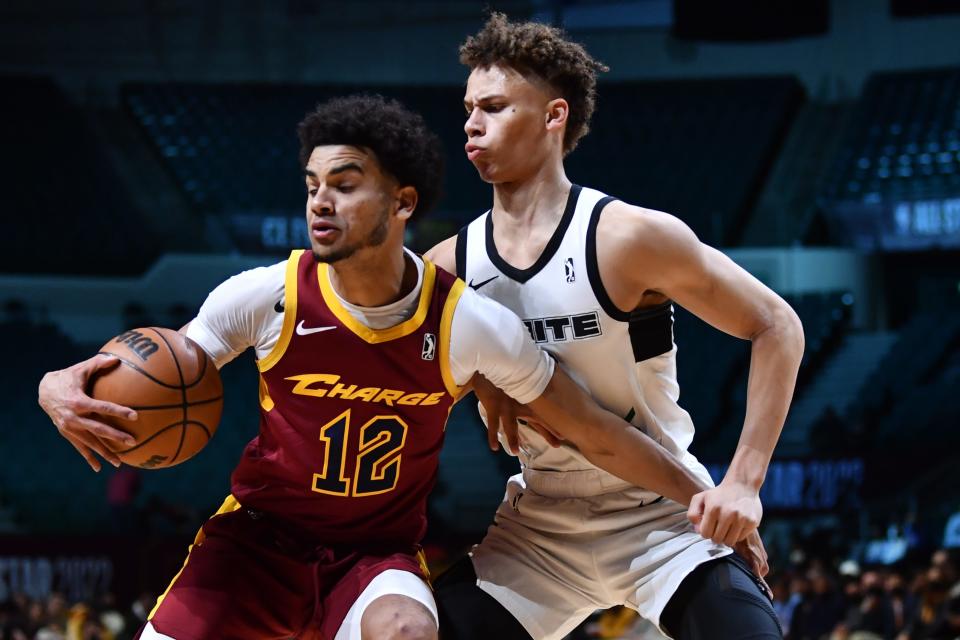 G League Ignite guard Dyson Daniels (right) defends Cleveland Charge forward Justin James (12). Daniels will earn playing time with his defense.