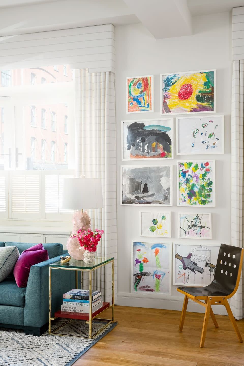 <p>Frame your children's best masterpieces and display them with pride. They'll feel like a proud artist, and won't have to spend a fortune on art—it's a win-win. It can look refined when professionally done with clean, modern frames and then arranged in a classic floor-to-ceiling grid. Take note from this charming contemporary family room designed by <a href="http://lillybunn.com/" rel="nofollow noopener" target="_blank" data-ylk="slk:Lilly Bunn;elm:context_link;itc:0;sec:content-canvas" class="link ">Lilly Bunn</a>, where colorful art animates the entire space.</p>