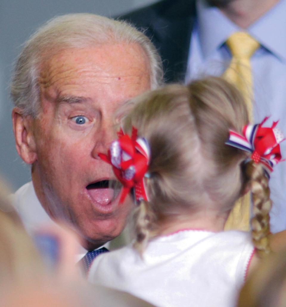 Vice President Joe Biden coaxes a smile from five-year-old Anya Thompson after his speech at PCT Engineered Systems in Davenport, Iowa on Wednesday March 28, 2012. (AP Photo/The Quad City Times, Kevin E. Schmidt)