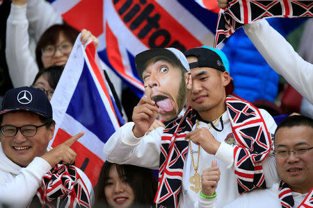 FILE PHOTO: Supporters of Mercedes' Lewis Hamilton before the Chinese Grand Prix - Shanghai, China - April 15, 2018. REUTERS/Aly Song/File Photo