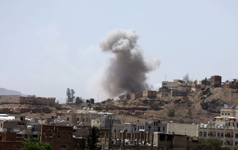 Dust rises from the site of a Saudi-led air strike in Sanaa