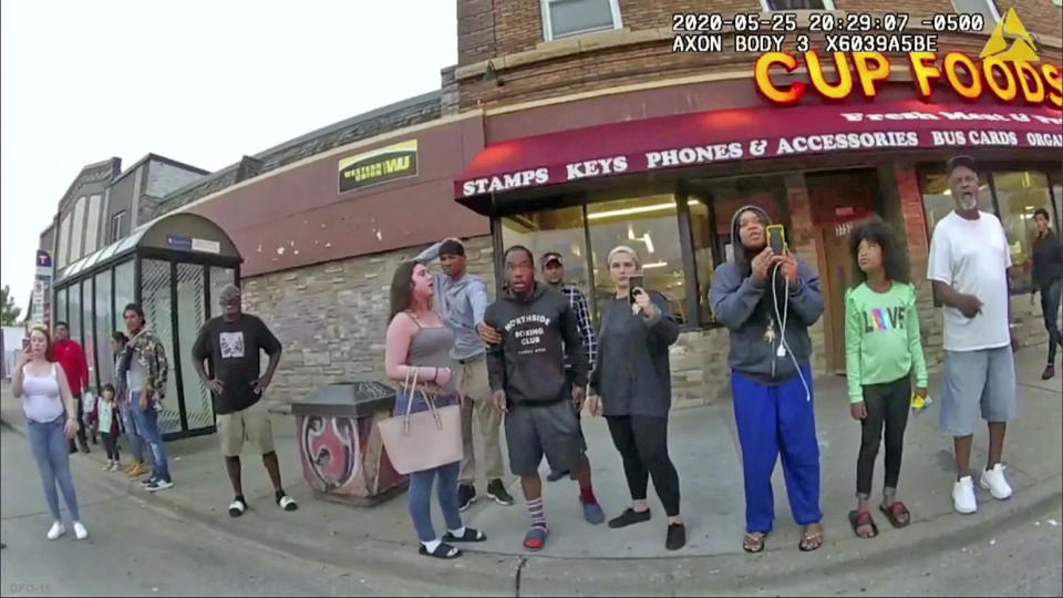 Darnella Frazier, third from right, films as former Minneapolis police officer Derek Chauvin presses his knee on George Floyd's neck for several minutes in Minneapoli on May 25, 2020. (Minneapolis Police Department via AP file)