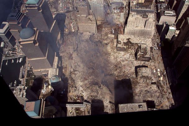 PHOTO: Smoke continues to rise from the destroyed World Trade Center, Sept, 19, 2001 in New York.  (Patrick Kovarik/AFP via Getty Images)