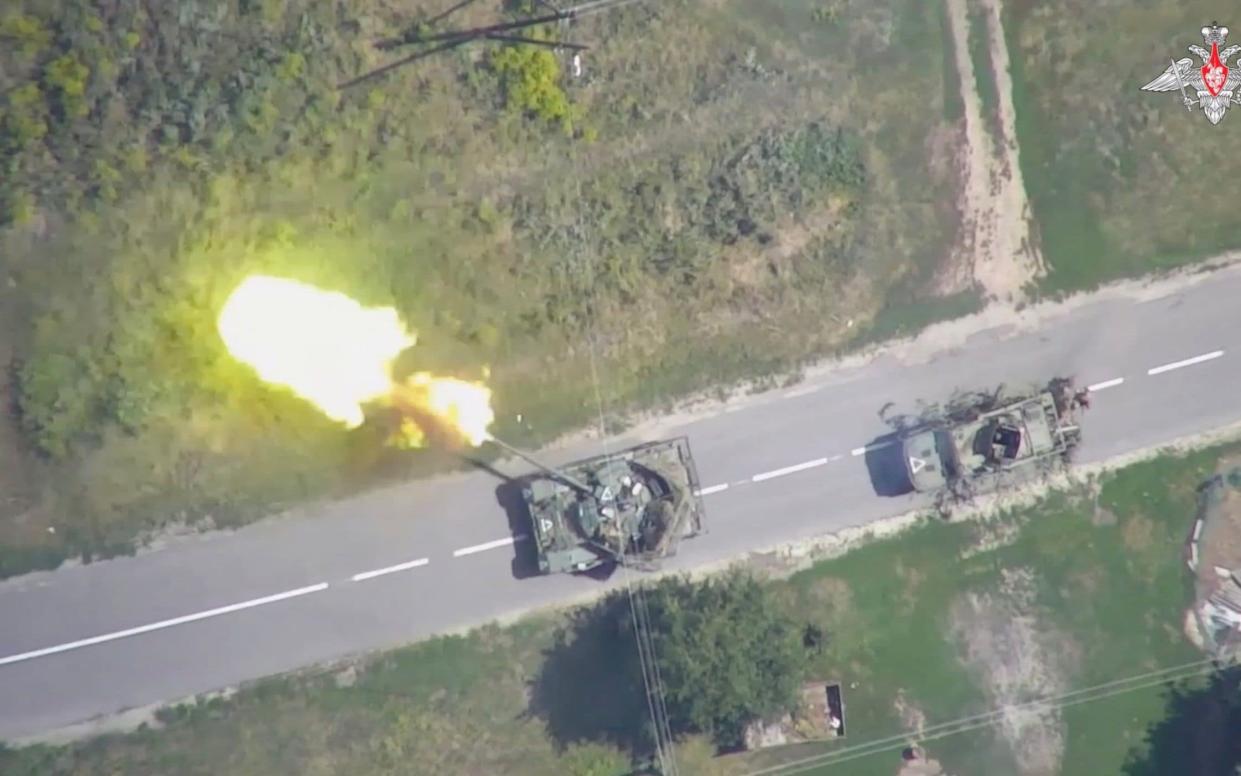 An aerial view shows what is said to be a firing Ukrainian tank in the Kursk region