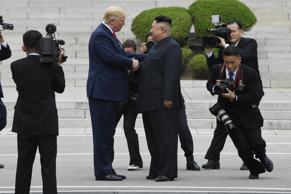 President Donald Trump walks to the North Korean side of the border with North Korean leader Kim Jong Un at the border village of Panmunjom in the Demilitarized Zone, South Korea, Sunday, June 30, 2019. (AP Photo/Susan Walsh)