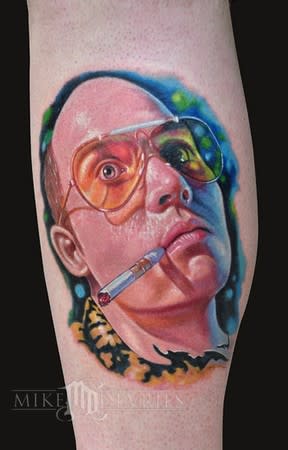 <div class="caption-credit"> Photo by: Mike Devries/mdtattoos.com</div>Johnny Depp's desire to be Hunter Thompson is actualized on a mysterious body part. (Arm? Calf? Human engineered limb-like substance commissioned by Johnny Depp for personal collection?)