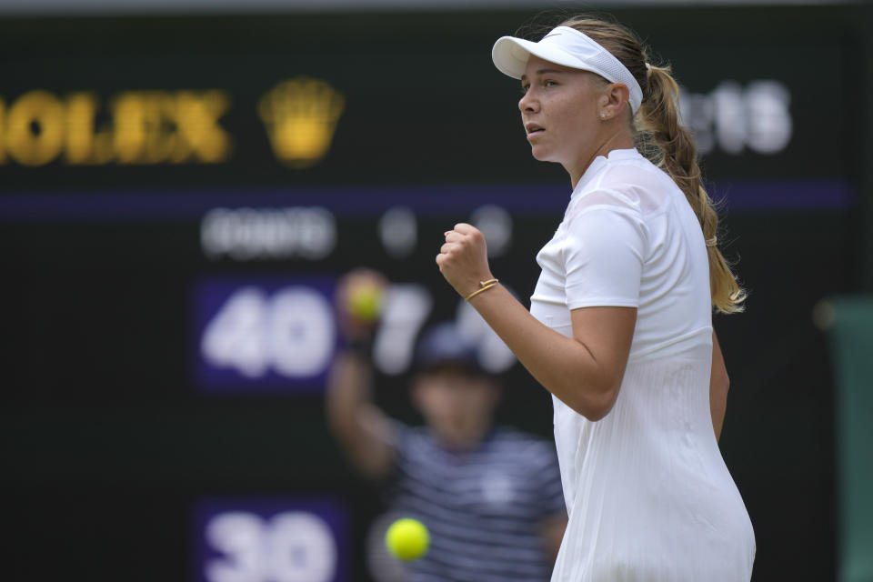 Amanda Anisimova of the US celebrates winning a point against Coco Gauff of the US in a third round women's singles match on day six of the Wimbledon tennis championships in London, Saturday, July 2, 2022. (AP Photo/Alastair Grant)