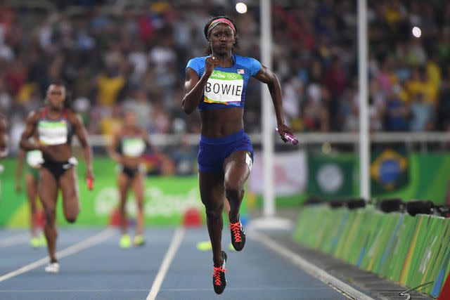 <p>OLIVIER MORIN/AFP via Getty </p> USA's Tori Bowie runs with the baton in the Women's 4x100m Relay Final during the athletics event at the Rio 2016 Olympic Games.