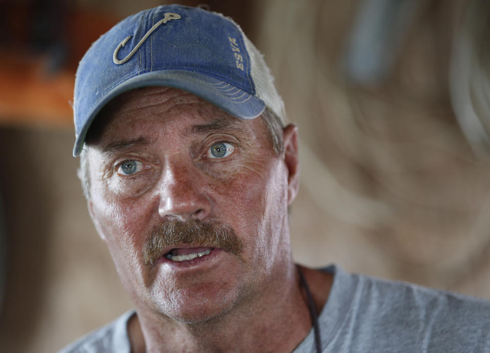 FIL - In this Wednesday May 17, 2017 file photo, Tangier Island mayor, James "Ooker" Eskridge, talks during an interview in Tangier, Va. The fishing community in the middle of the Chesapeake Bay has reported zero cases of the coronavirus. But the virus would be devastating if it were to reach the island, which has a large elderly population and no full-time doctor. (AP Photo/Steve Helber)