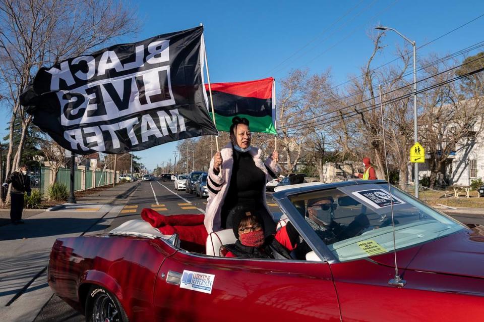 Black Lives Matter Sacramento founder Tanya Faison leads the #ReclaimMLK Day car caravan organized by BLM Sacramento and the NCAAP in celebration of Martin Luther King Jr. Day as they start from Grant High School on Monday, Jan. 18, 2021 in Sacramento.