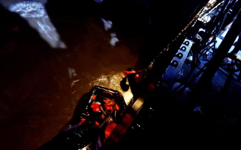 A handout photo made available by the Indian Navy shows Indian Navy members conducting a search and rescue (SAR) operation with the Indian Naval Ship INS Kolkata by picking up two survivors from a life raft of the vessel Vara Prabha at sea, near Mumbai, India,  - INDIAN NAVY HANDOUT/EPA-EFE/Shutterstoc