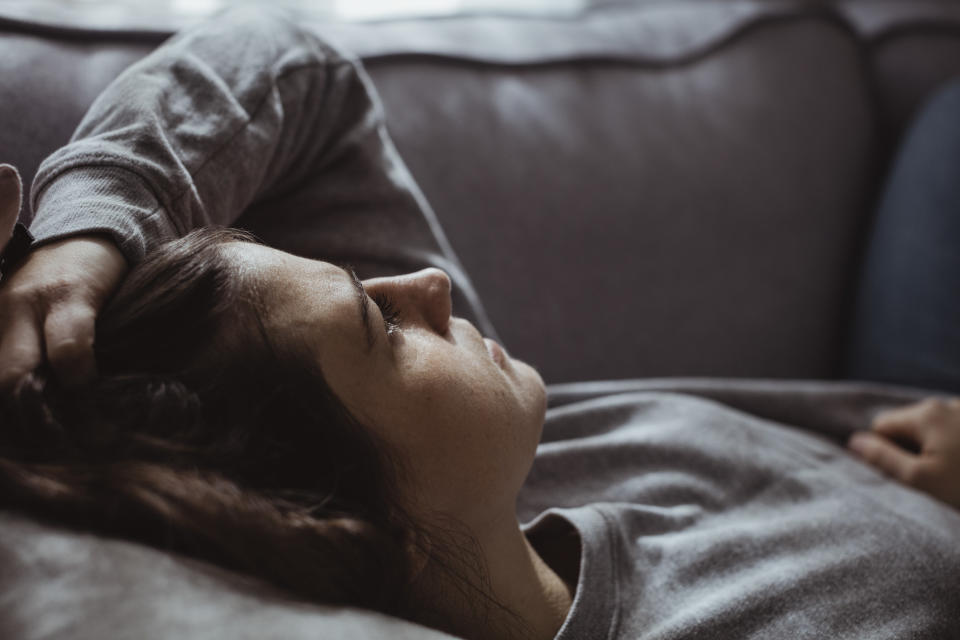 close up of a person laying down staring at the ceiling