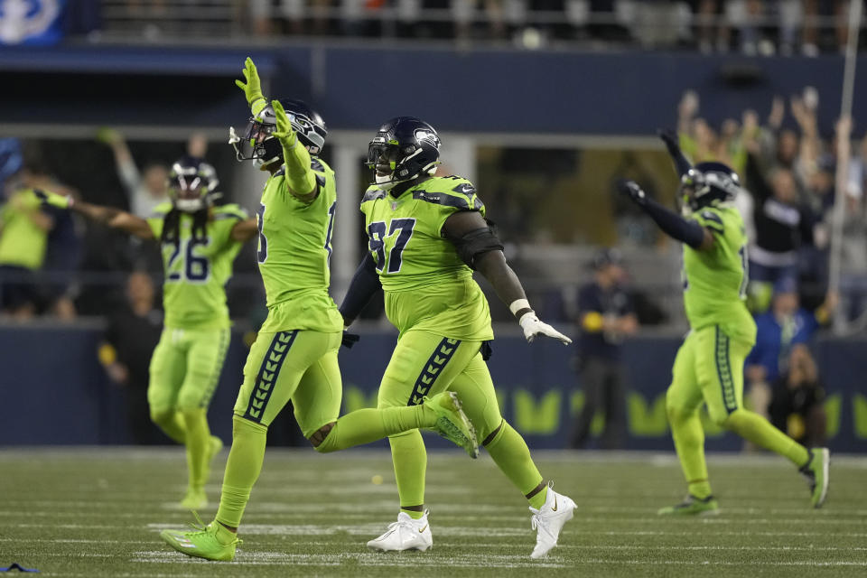 Seattle Seahawks defensive tackle Poona Ford (97) celebrates with teammates after a field goal attempt by Denver Broncos Wendt wide during the second half of an NFL football game, Monday, Sept. 12, 2022, in Seattle. The Seahawks won 17-16. (AP Photo/Stephen Brashear)