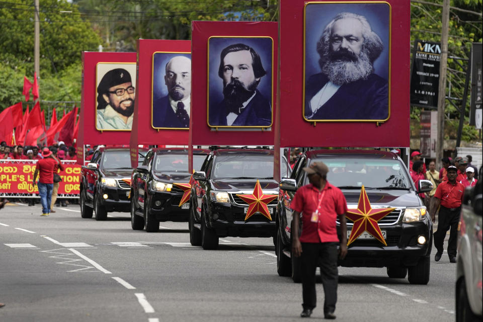Portraits of Communist icons, from right, Karl Marx, Friedrich Engels, Vladimir Lenin are carried on cars during a rally organized by People's Liberation Front, a marxist political party, to mark May Day in Colombo, Sri Lanka, Monday, May 1, 2023. (AP Photo/Eranga Jayawardena)
