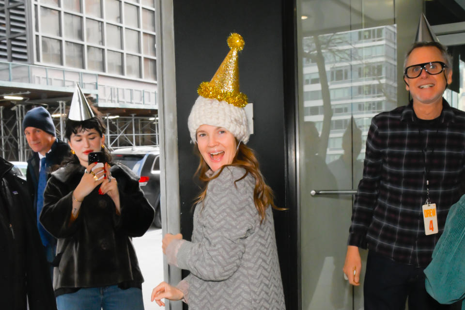 Closeup of Drew Barrymore wearing a party hat