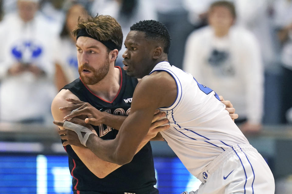Gonzaga forward Drew Timme, left, guards BYU forward Fousseyni Traore, right, during the first half of an NCAA college basketball game Thursday, Jan. 12, 2023, in Provo, Utah. (AP Photo/Rick Bowmer)