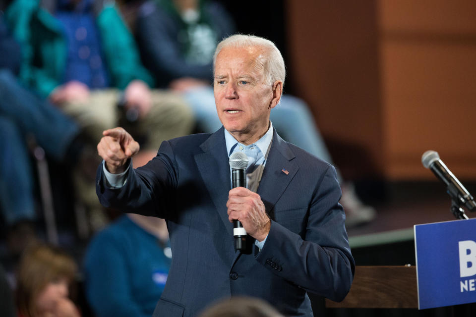Former Vice President Joe Biden takes questions at a Dec. 30 campaign town hall in Derry, New Hampshire. Biden favors a public option for health coverage. (Photo: Scott Eisen via Getty Images)