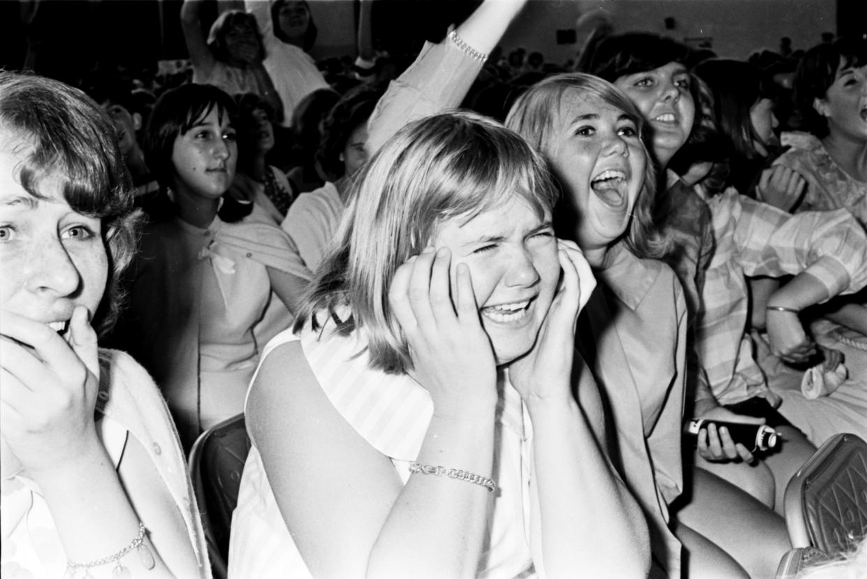 The Rolling Stones perform to screaming fans at a matinee concert at Sydney Showground, January 23 1965. (Photo by George Lipman/The Sydney Morning Herald/Fairfax Media via Getty Images via Getty Images).