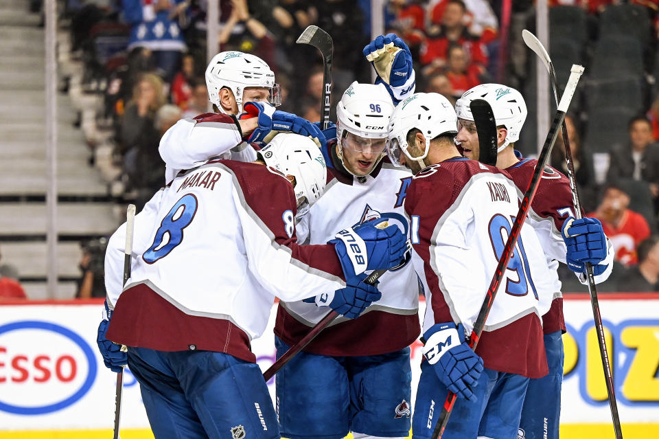 CALGARY, AB - MARCH 29: Colorado Avalanche Left Wing Valeri Nichushkin (13) celebrates a goal with Colorado Avalanche Defenceman Cale Makar (8), Colorado Avalanche Right Wing Mikko Rantanen (96), Colorado Avalanche Center Nazem Kadri (91) and Colorado Avalanche Defenceman Devon Toews (7) during the third period of an NHL game where the Calgary Flames hosted the Colorado Avalanche on March 29, 2022, at the Scotiabank Saddledome in Calgary, AB. (Photo by Brett Holmes/Icon Sportswire via Getty Images)