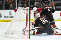 Calgary Flames left wing Andrei Kuzmenko (96) scores past Anaheim Ducks goaltender John Gibson (36) and Ducks' Urho Vaakanainen during the second period of an NHL hockey game Friday, April 12, 2024, in Anaheim, Calif. (AP Photo/Kyusung Gong)