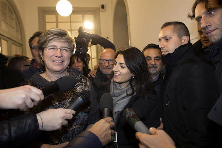 Italy's anti-establishment 5-Star Movement member Giuliana Di Pillo (L) speaks with journalists next to Rome's mayor Virginia Raggi in Ostia, Italy, November 19, 2017. Picture taken November 19, 2017. REUTERS/Yara Nardi