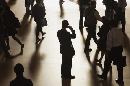 A man stands in the middle of Grand Central Terminal as he speaks on a cell phone, as passengers face limited train service on the New Haven Line between Stamford Station and Grand Central Terminal due to a Con Edison power problem in New York, September 25, 2013. REUTERS/Zoran Milich