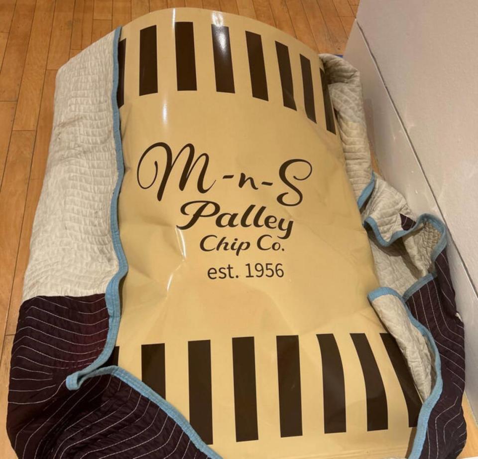 Hot out of the glass shop, “M-n-S Palley Chip Co. est. 1956.,” 2023, delivered to the Palley Pavilion. Hot sculpted glass with steel, 7 x 30 x 15 inches overall. 