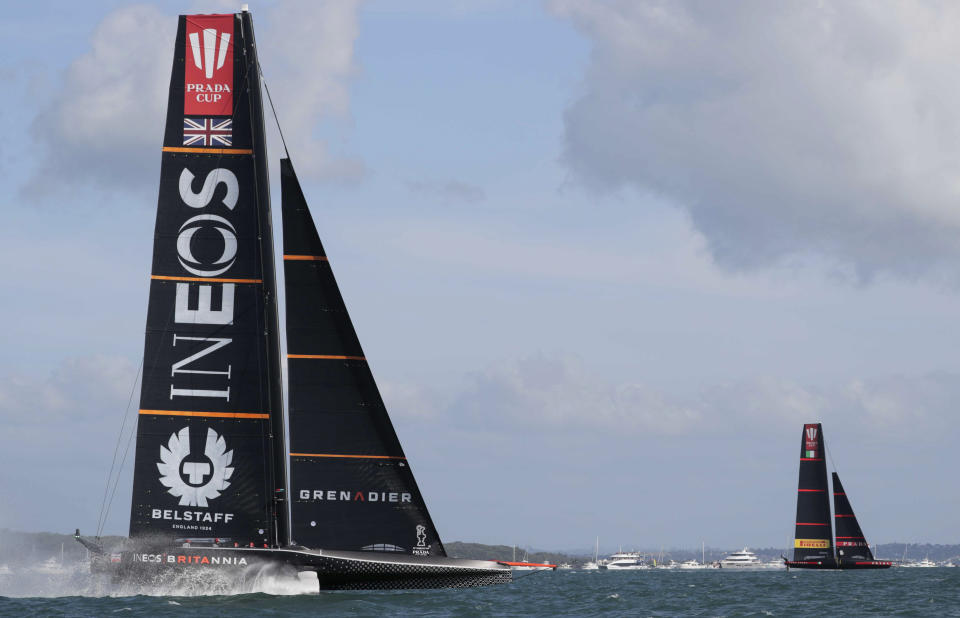 Italy's Luna Rossa, right, leads Britain's INEOS Team UK to win race one of the Prada Cup on Auckland's Waitemata Harbour, New Zealand, Saturday, Feb. 13, 2021. (Michael Craig/NZ Herald via AP)