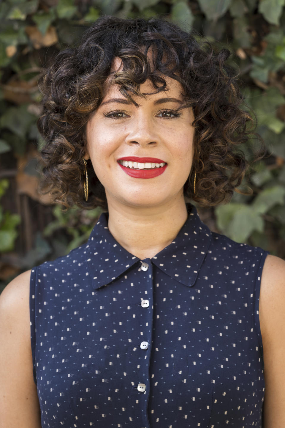 Charise Castro Smith poses for a portrait on Sept. 9, 2021, in Los Angeles to promote her Disney animated film "Encanto." The film, which she co-directs with Jared Bush and Byron Howard, is set in Colombia and follows a teenage girl dealing with the frustration of being the only member of her family without magical powers. (Photo by Willy Sanjuan/Invision/AP)