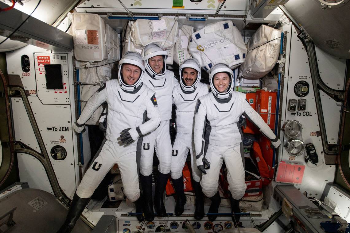 In this photo made available by NASA, four commercial crew astronauts, from left, European Space Agency astronaut Matthias Maurer and NASA astronauts Tom Marshburn, Raja Chari and Kayla Barron pose for a photo in their Dragon spacesuits during a fit check aboard the International Space Station’s Harmony module on April 21, 2022.