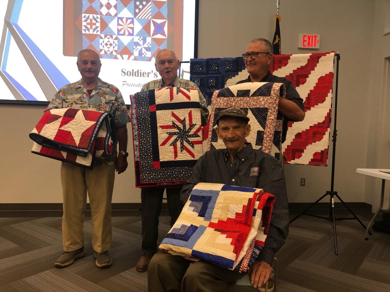From left are Quilts of Valor honorees Michael Geremia, Erby Bolt and Richard Donoghue, and seated is Joe Cooper.