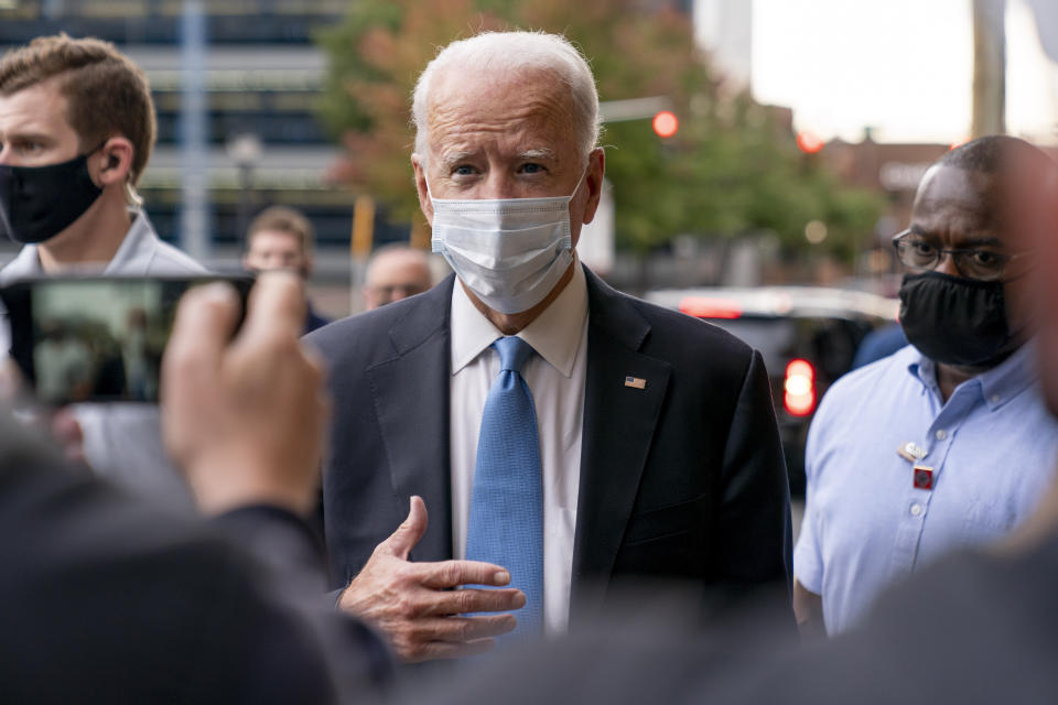 Democratic presidential candidate former Vice President Joe Biden stops to speak to members of the media as he walks out of the Queen Theater in Wilmington, Del., Thursday, Oct. 1, 2020, after pre-taping his speech for the Al Smith dinner. (AP Photo/Andrew Harnik)