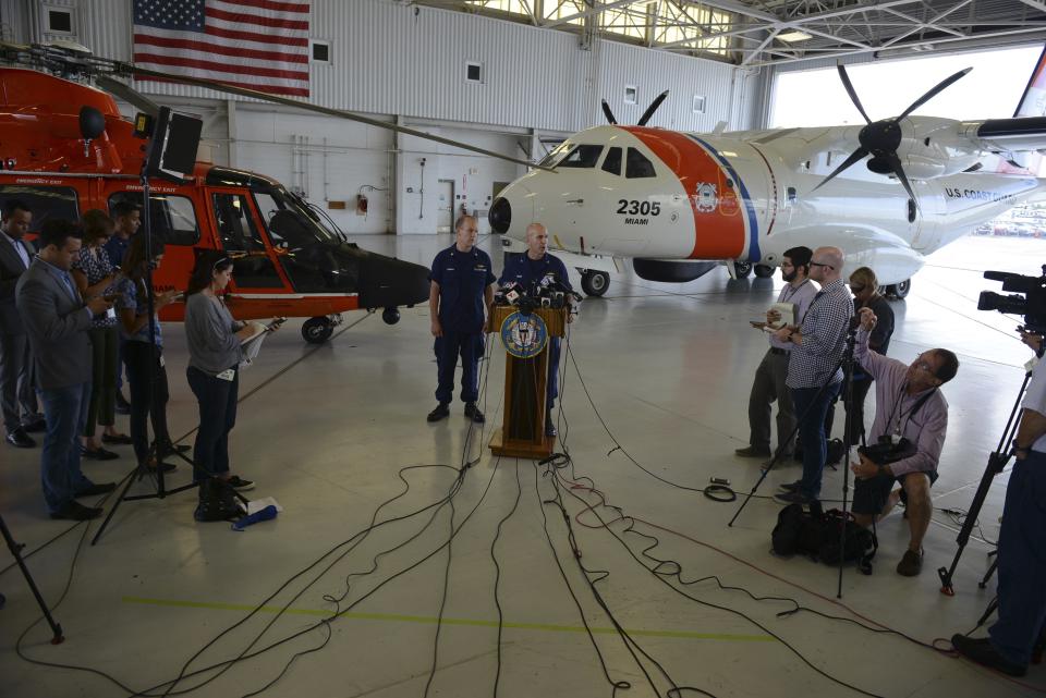 Coast Guard Capt. Mark Fedor responds to questions during a press conference for search-and-rescue operations for a missing container ship, El Faro, at Coast Guard Air Station Miami, October 5, 2015 in a photo provided by the U.S. Coast Guard. The U.S. Coast Guard on Monday said its crews had found a body and an empty, heavily damaged lifeboat in their search for the cargo ship El Faro, assumed to have sunk off the Bahamas in towering waves and howling winds whipped up by Hurricane Joaquin. "We're assuming the vessel has sunk," Coast Guard Captain Mark Fedor told reporters in Miami. He said rescuers are no longer looking for the ship, which sent a distress call four days ago after getting caught in Joaquin's 50-foot seas. (REUTERS/U.S. Coast Guard/Petty Officer 2nd Class Mark Barney)