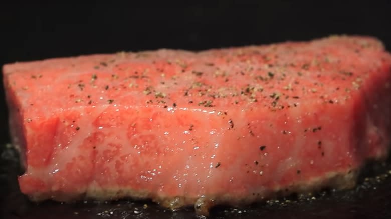 Close up of seasoned Olive Wagyu