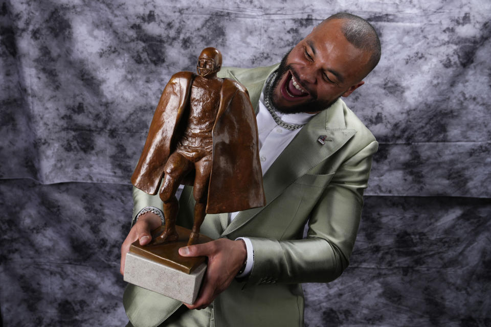 Walter Payton Player of the Year Award winner, Dallas Cowboys' Dak Prescott, poses for a photo during the NFL Honors award show ahead of the Super Bowl 57 football game, Thursday, Feb. 9, 2023, in Phoenix. (AP Photo/Ross D. Franklin)