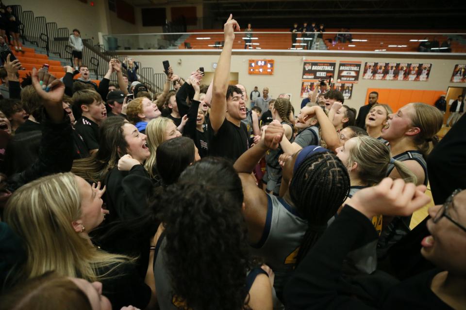 Copley students and the members of girls basketball team celebrate their victory over Bryan in the OHSAA Division II Regional final game at Mansfield High School on Friday March 8, 2024.