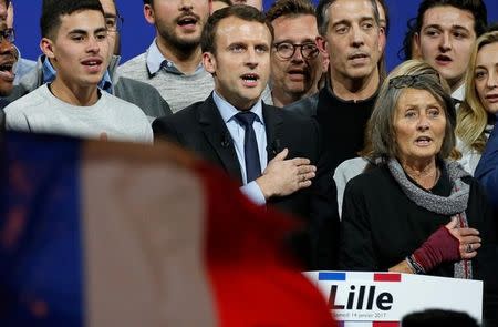 Emmanuel Macron, head of the political movement En Marche !, or Forward !, and candidate for the 2017 French presidential election, sings the French national anthem at the end of a political rally in Lille, France January 14, 2017. REUTERS/Pascal Rossignol