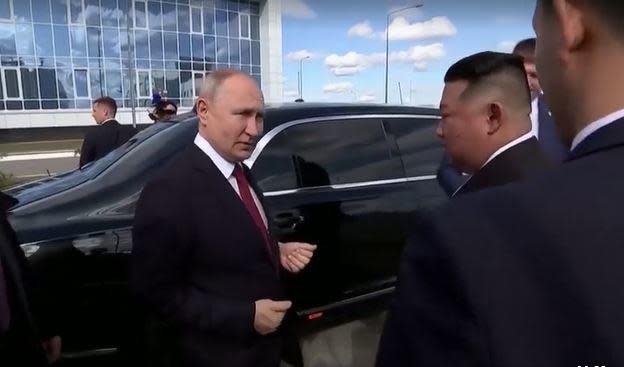 Russian President Vladimir Putin shows North Korean leader Kim Jong Un his Russian-made Aurus limousine, Sept. 13, 2023, outside the Vostochny Cosmodrome in Russia's Far East region, ahead of their summit. / Credit: Reuters