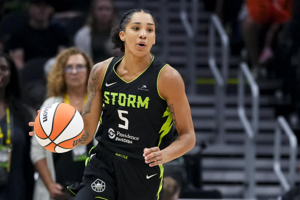 Seattle Storm forward Gabby Williams moves the ball against the New York Liberty during the first half of a WNBA basketball game Friday, Aug. 30, 2024, in Seattle. (AP Photo/Lindsey Wasson)