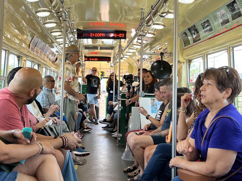 Artist Hal Marcus regales passengers on the El Paso Streetcar during an art tour on May 6.