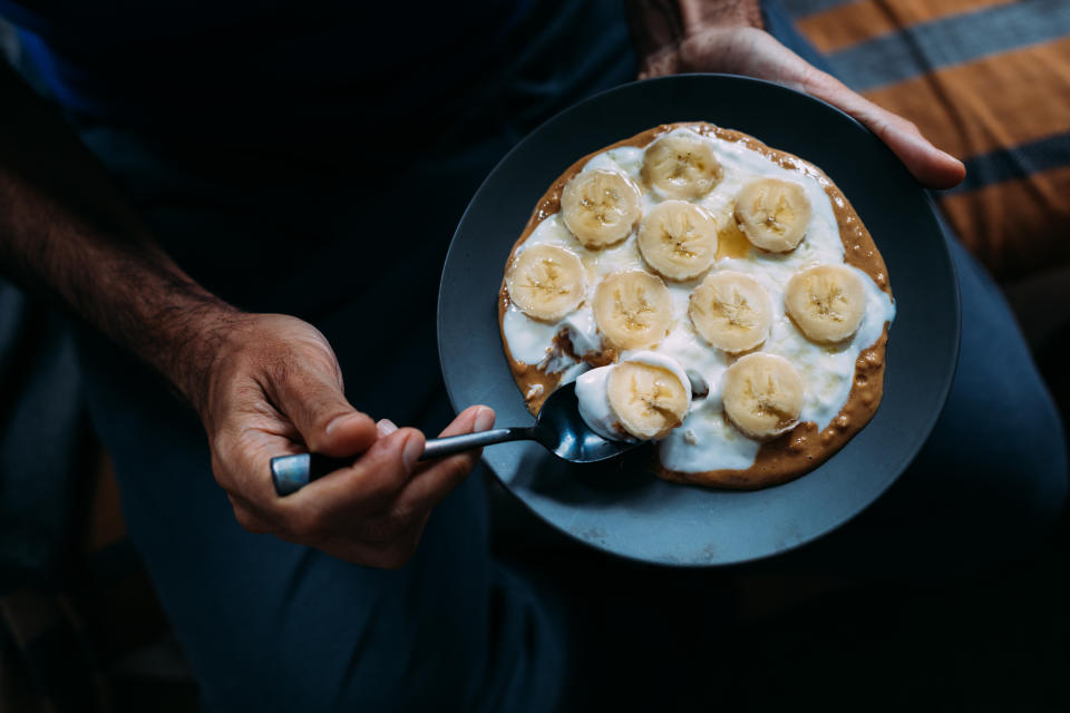 Man snacking at night. (Getty Images)