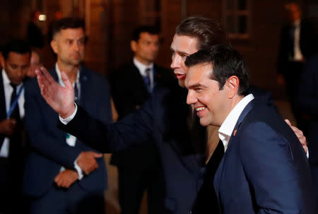 Greek Prime Minister Alexis Tsipras is welcomed by Austrian Chancellor Sebastian Kurz as he arrives for the informal meeting of European Union leaders ahead of the EU summit, in Salzburg, Austria, September 19, 2018. REUTERS/Leonhard Foeger