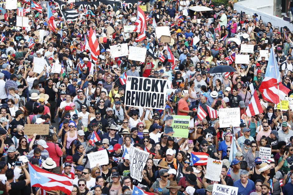 Thousands of demonstrators protesting against Ricardo Rossello, the Governor of Puerto Rico July 17, 2019 in front of the Capitol Building in Old San Juan, Puerto Rico. The sign reads Ricky resign. (Photo: Jose Jimenez/Getty Images)