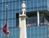 <p>The Confederate battle flag is removed from the pole at the South Carolina statehouse grounds during a ceremony in Columbia, July 10, 2015. South Carolina removed the Confederate battle flag from the state capitol grounds after three weeks of emotional debate over the banner, a symbol of slavery and racism to many, of Southern heritage and pride to others. (Photo: Jason Miczek/Reuters) </p>