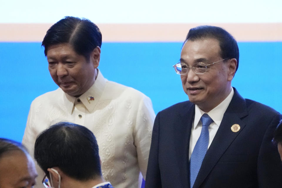 China's Premier Li Keqiang, right, walk with Philippine's President Ferdinand Marcos, Jr. after group photo of the ASEAN - China Summits (Association of Southeast Asian Nations) in Phnom Penh, Cambodia, Friday, Nov. 11, 2022. Association of Southeast Asian Nations leaders struggled Friday to come to a consensus on how to pressure Myanmar to comply with a plan for peace, with violence in the member state spiraling out of control since the military seized power in 2021. (AP Photo/Heng Sinith)