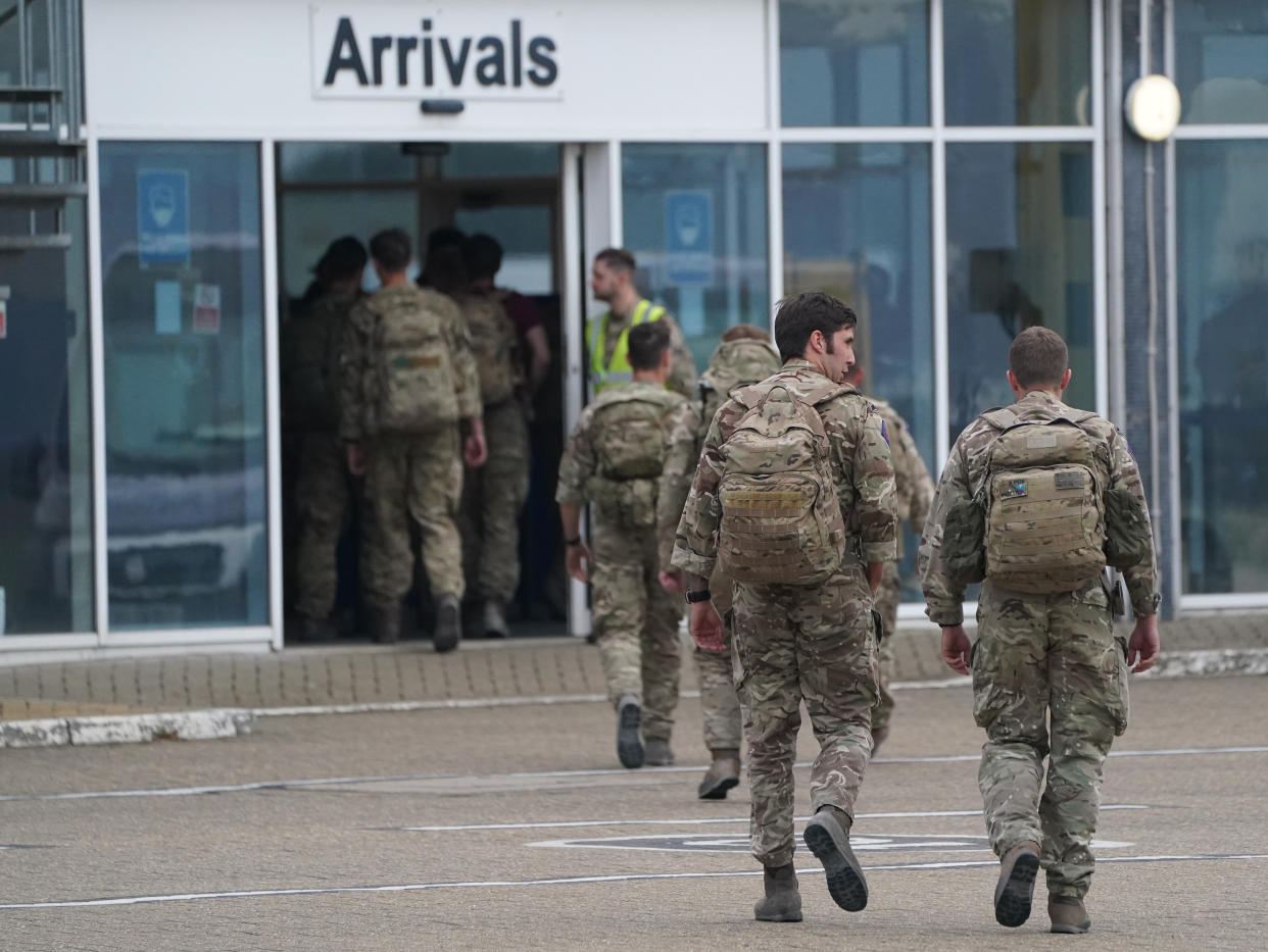 Members of the British armed forces 16 Air Assault Brigade walk to the air terminal after departing a flight from Afghanistan at RAF Brize Norton, Oxfordshire. The final UK troops and diplomatic staff were airlifted from Kabul on Saturday, drawing to a close Britain's 20-year engagement in Afghanistan and a two-week operation to rescue UK nationals and Afghan allies. Picture date: Sunday August 29, 2021.