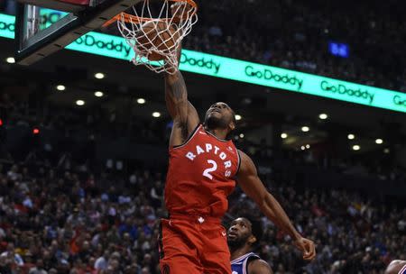 Dec 5, 2018; Toronto, Ontario, CAN; Toronto Raptors forward Kawhi Leonard (2) dunks for a basket against Philadelphia 76ers in the second half at Scotiabank Arena. Dan Hamilton-USA TODAY Sports