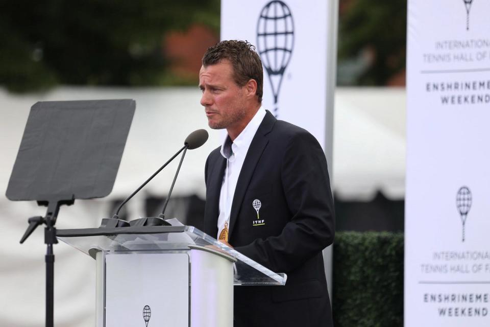 Lleyton Hewitt speaks during his induction ceremony on the front lawn courts during the Infosys Hall of Fame Open on Saturday night in Newport.