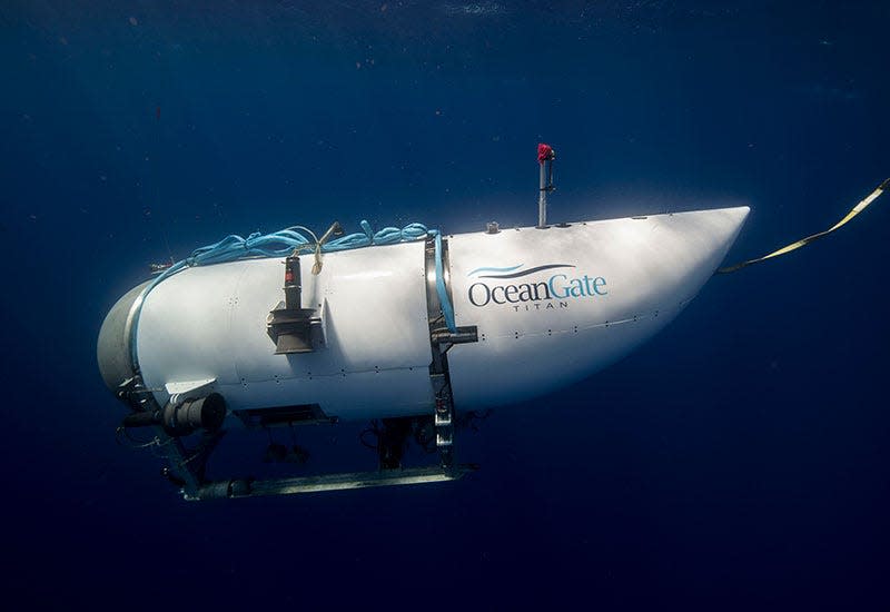 A side view of the Titan submersible in water.