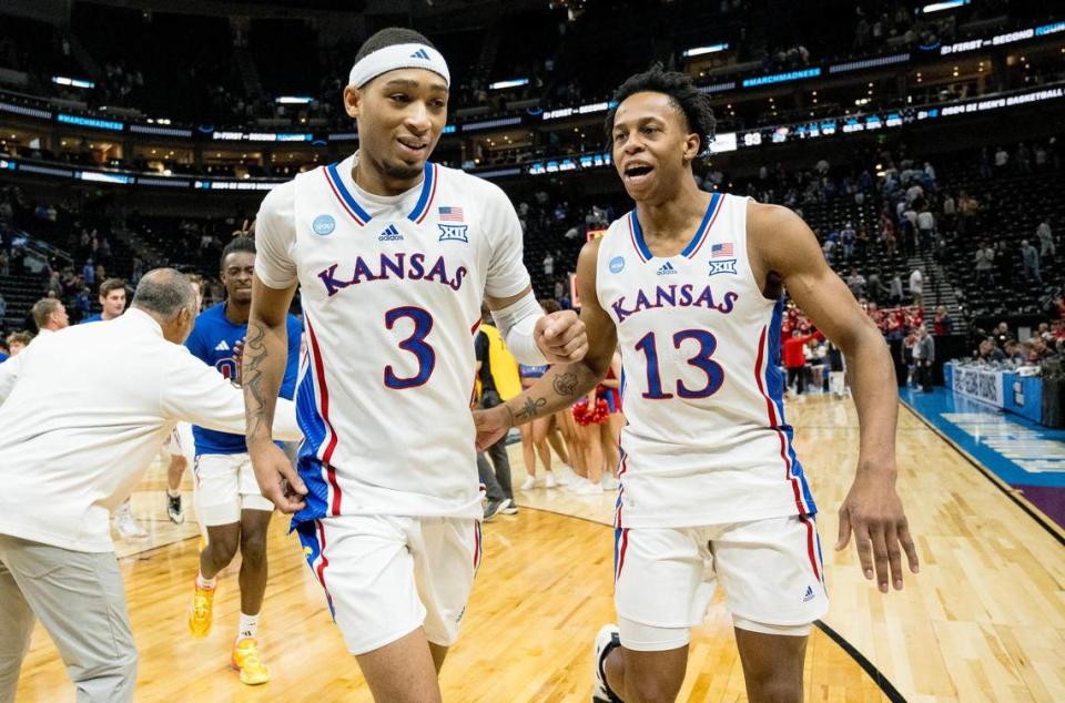 Kansas Jayhawks guard Dajuan Harris Jr. (3) runs off the court as guard Elmarko Jackson (13) celebrates after Kansas defeated the Samford Bulldogs 93-89 in a men’s college basketball game in the first round of the NCAA Tournament on Thursday, March 21, 2024, in Salt Lake City, Utah.
